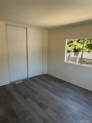 a bathroom with a toilet a sink and a window