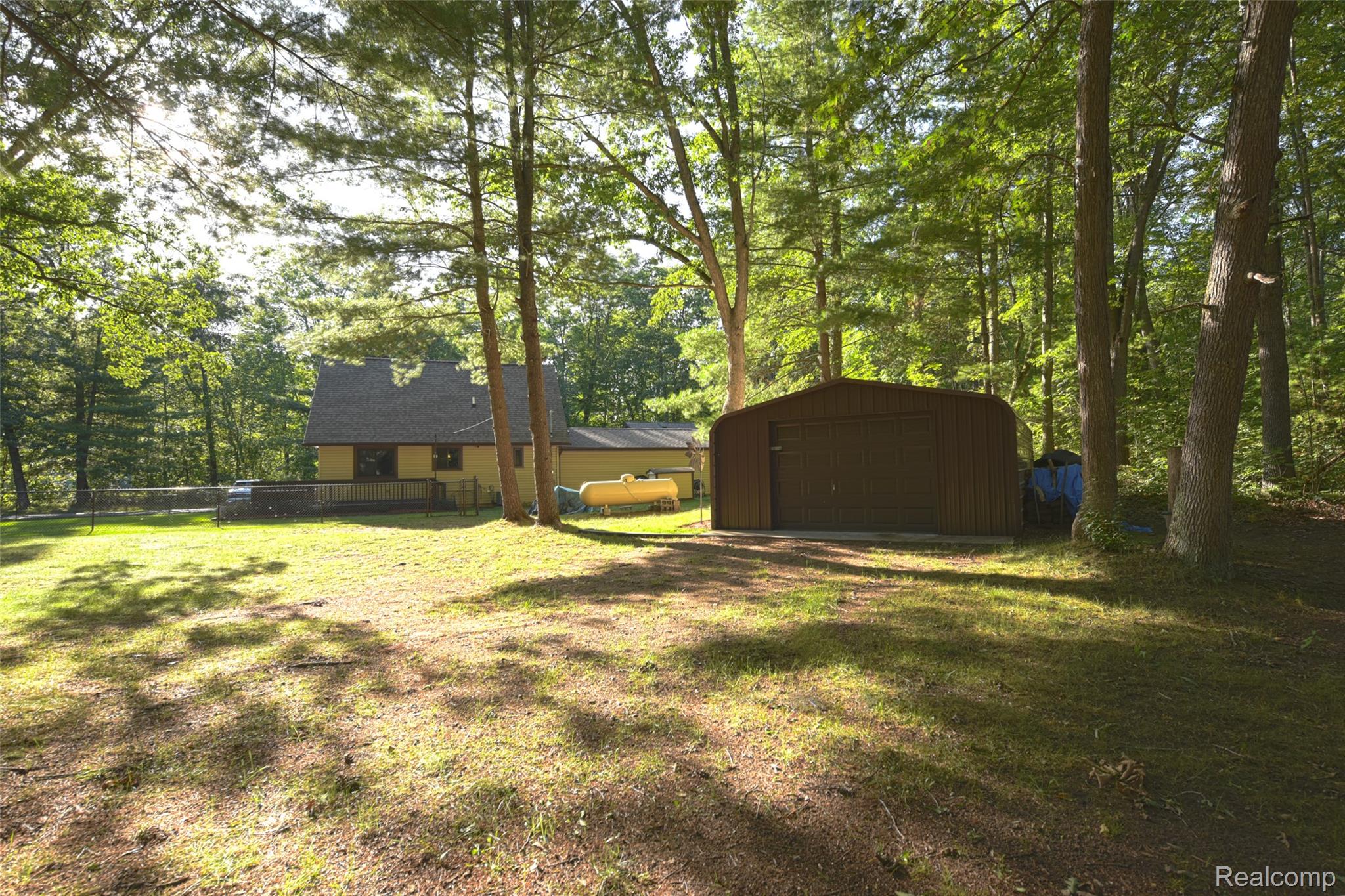5799 Goodar Road South Branch, MI 48761 - Photo 50 of 58 Park-like setting with a newer detached metal storage structure ready for two ORV's