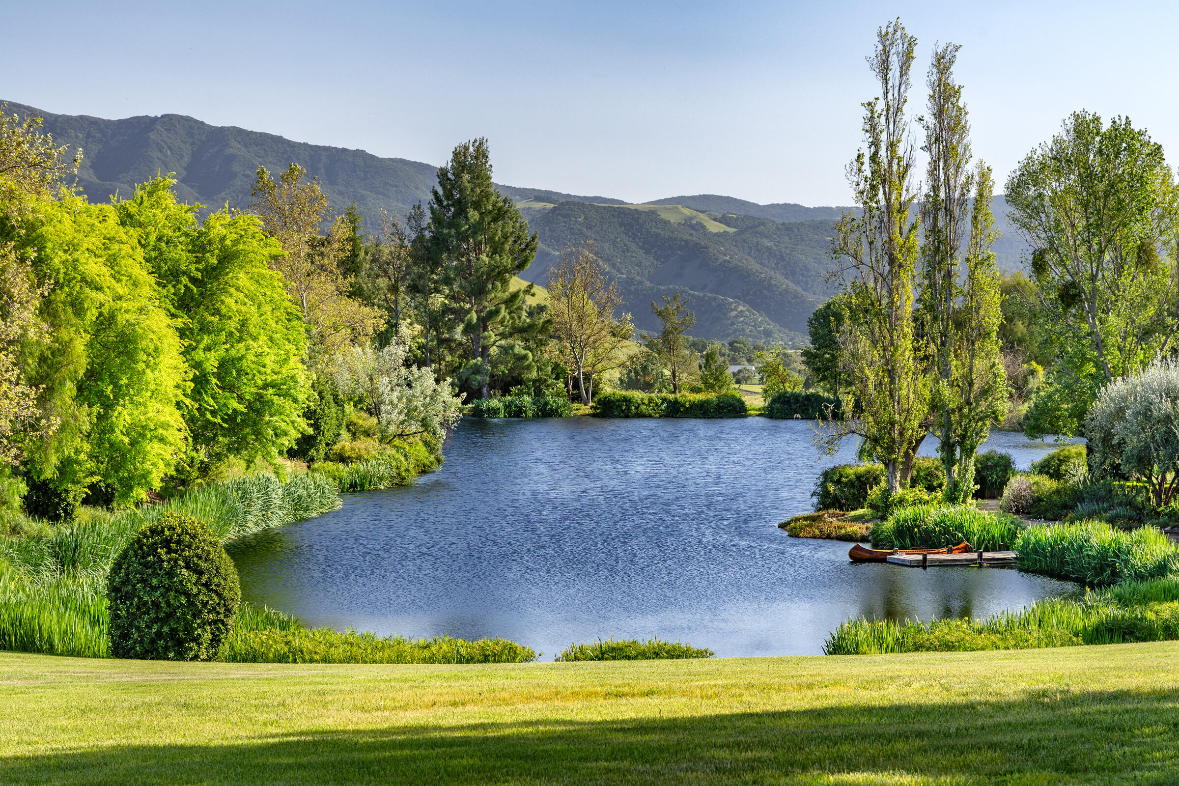 1620 Westerly Road Santa Ynez, CA 93460 - Photo 26 of 41 a view of a lake with a mountain in the background