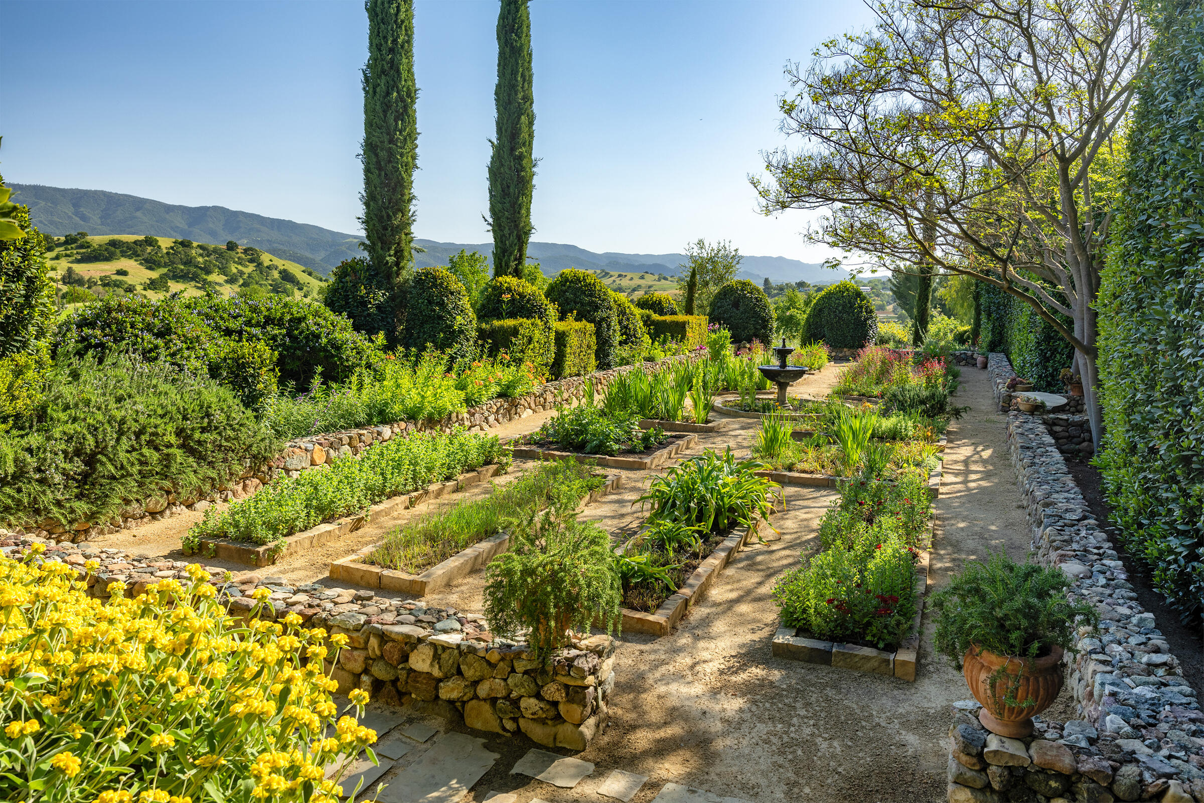 1620 Westerly Road Santa Ynez, CA 93460 - Photo 34 of 41 a view of a garden with a fountain