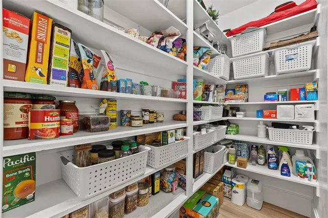 a bathroom with a sink mirror and toilet