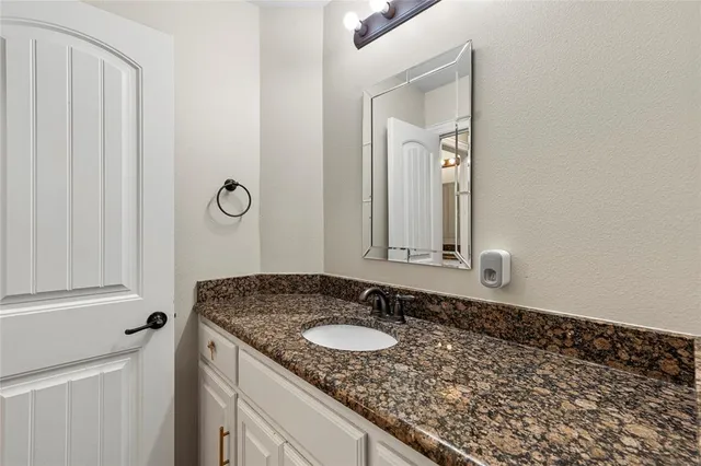 a bedroom with furniture and a book shelf