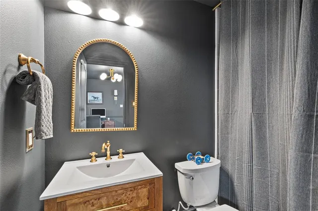 a bedroom with a bed and a table in it