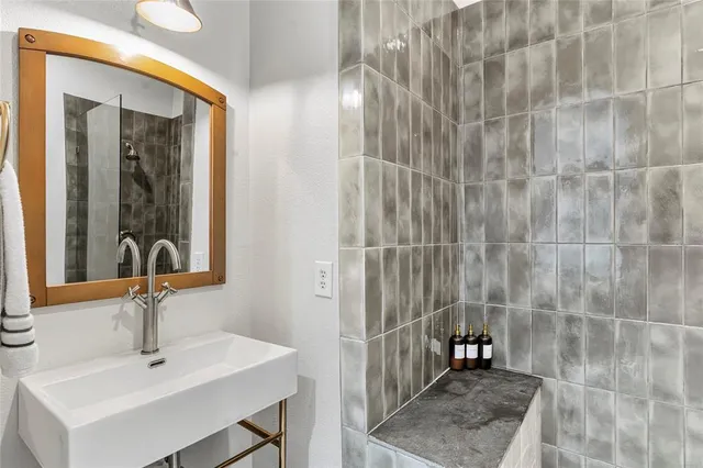 a view of a patio with couches and table and chairs and potted plants