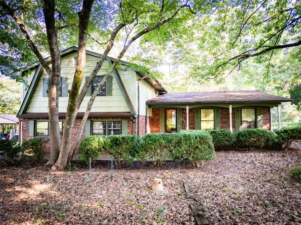 17 Valley Trail Covington, GA 30014 - Photo 1 of 19 a front view of a house with a garden