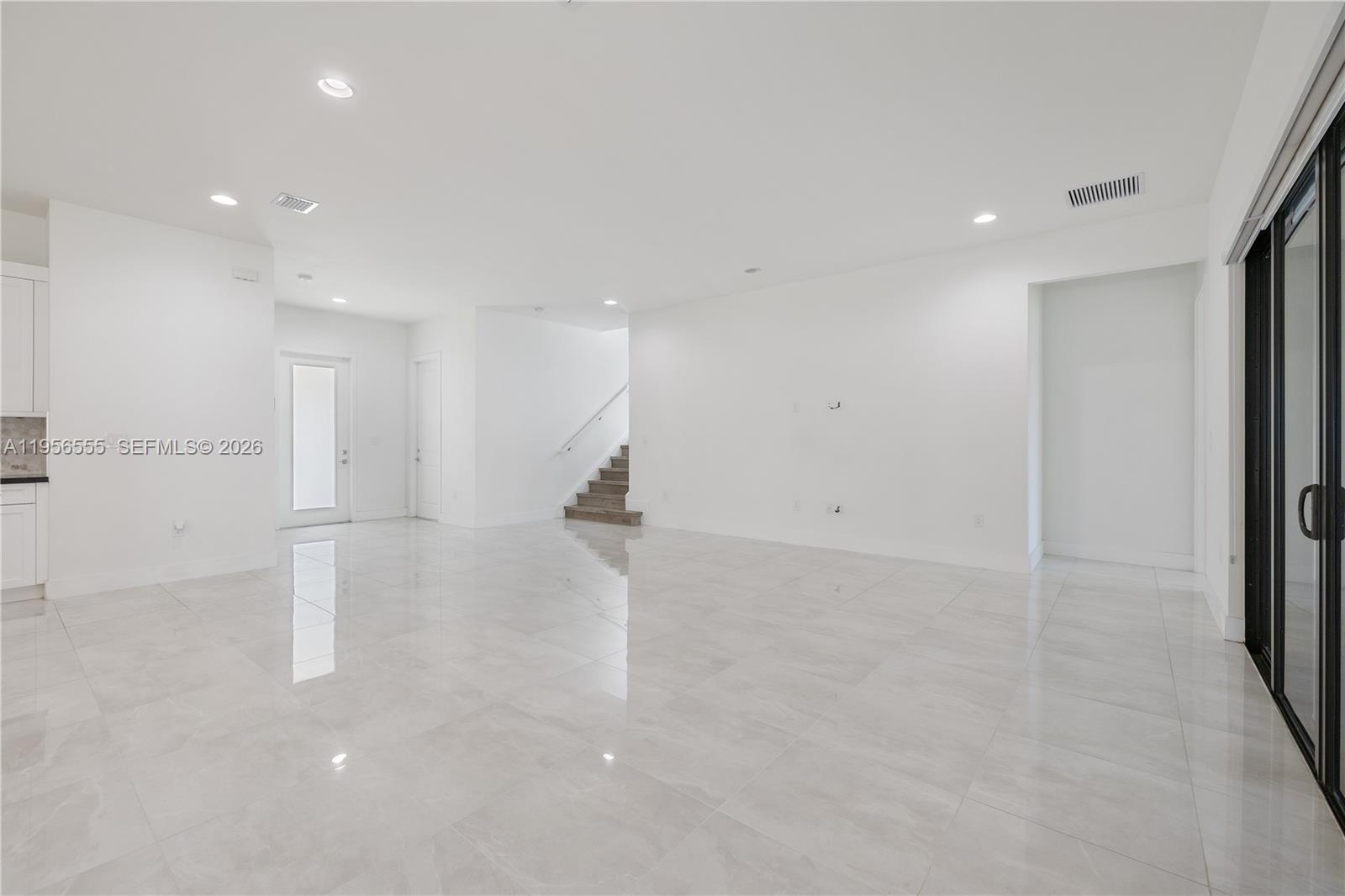 17665 Southwest 46th Street Miramar, FL 33029 - Photo 17 of 41 an empty room with a kitchen space and a window