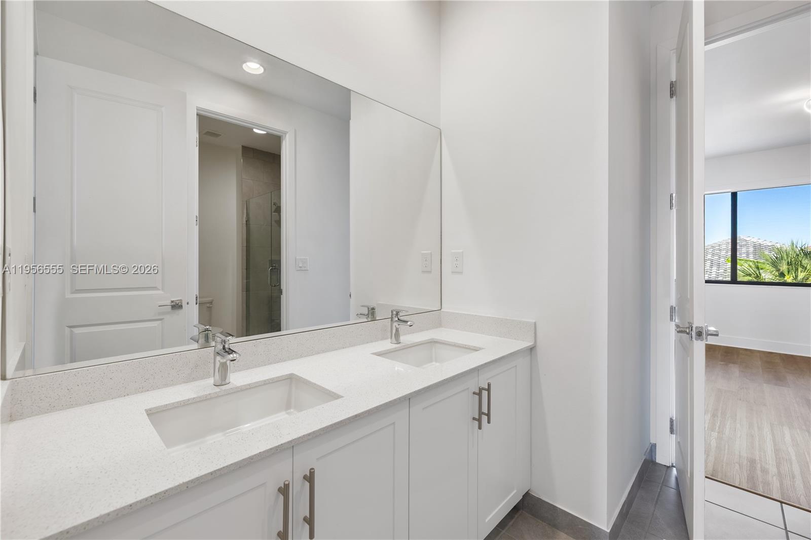 17665 Southwest 46th Street Miramar, FL 33029 - Photo 24 of 41 a bathroom with a sink and a mirror