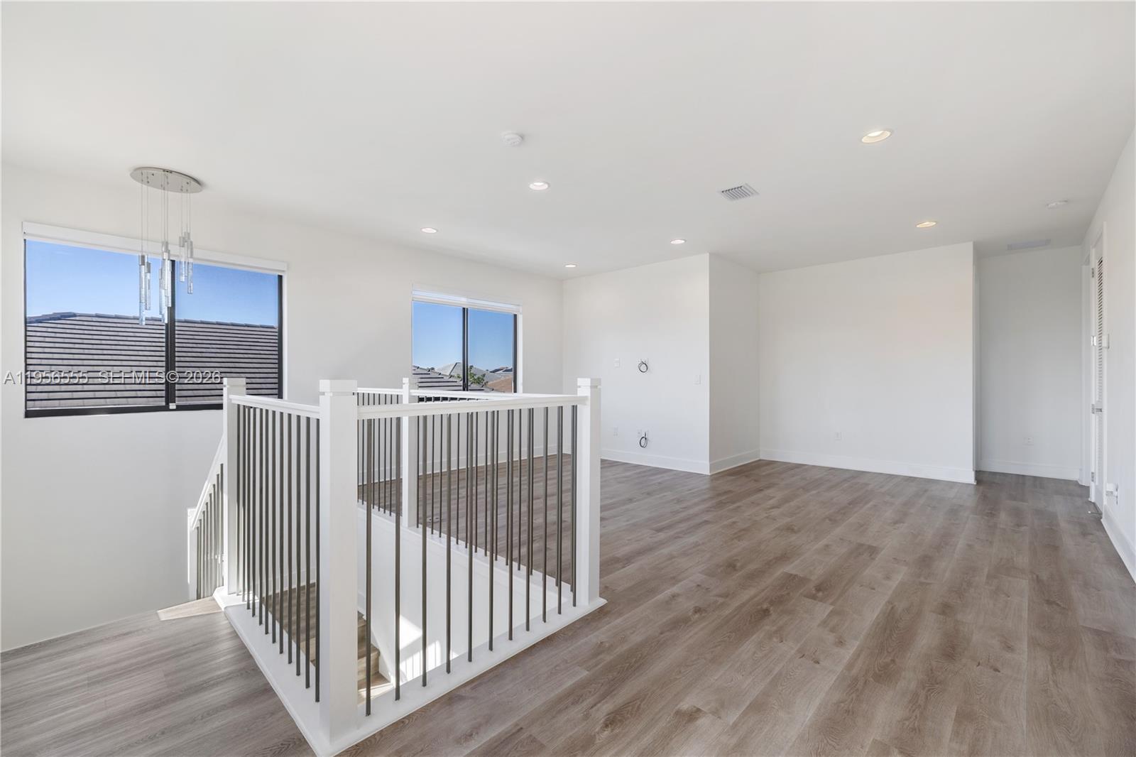 17665 Southwest 46th Street Miramar, FL 33029 - Photo 28 of 41 a view of a kitchen with wooden floor and staircase