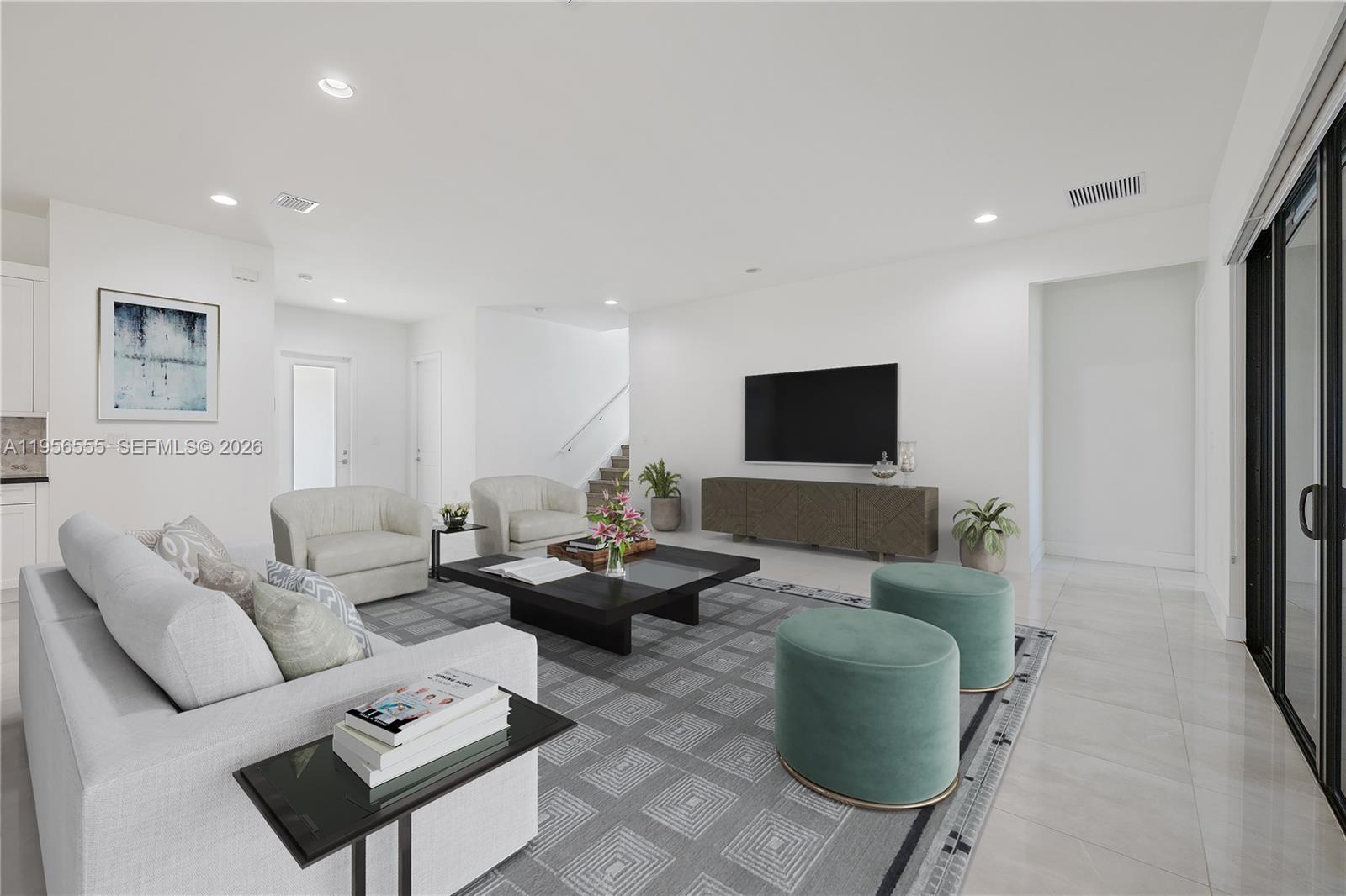 17665 Southwest 46th Street Miramar, FL 33029 - Photo 3 of 41 a living room with furniture and a flat screen tv