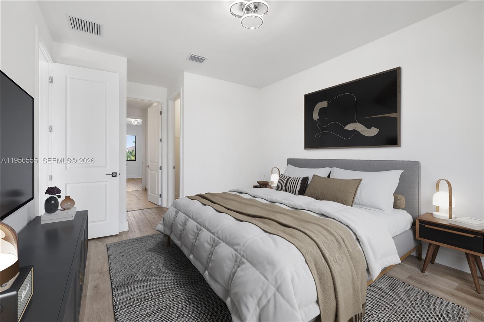 17665 Southwest 46th Street Miramar, FL 33029 - Photo 7 of 41 a bedroom with bed and a flat screen tv