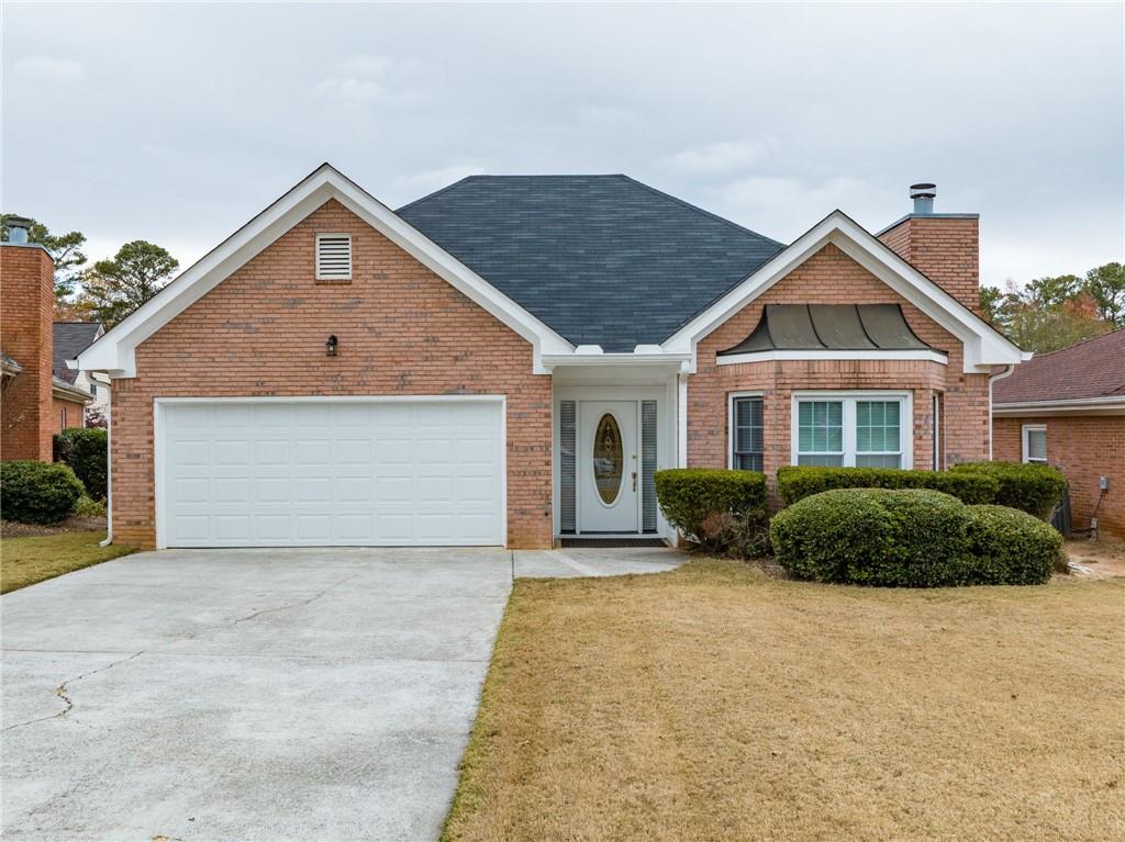 4621 Driftwater Road Duluth, GA 30096 - Photo 1 of 1 View of front of property with a garage and a front yard