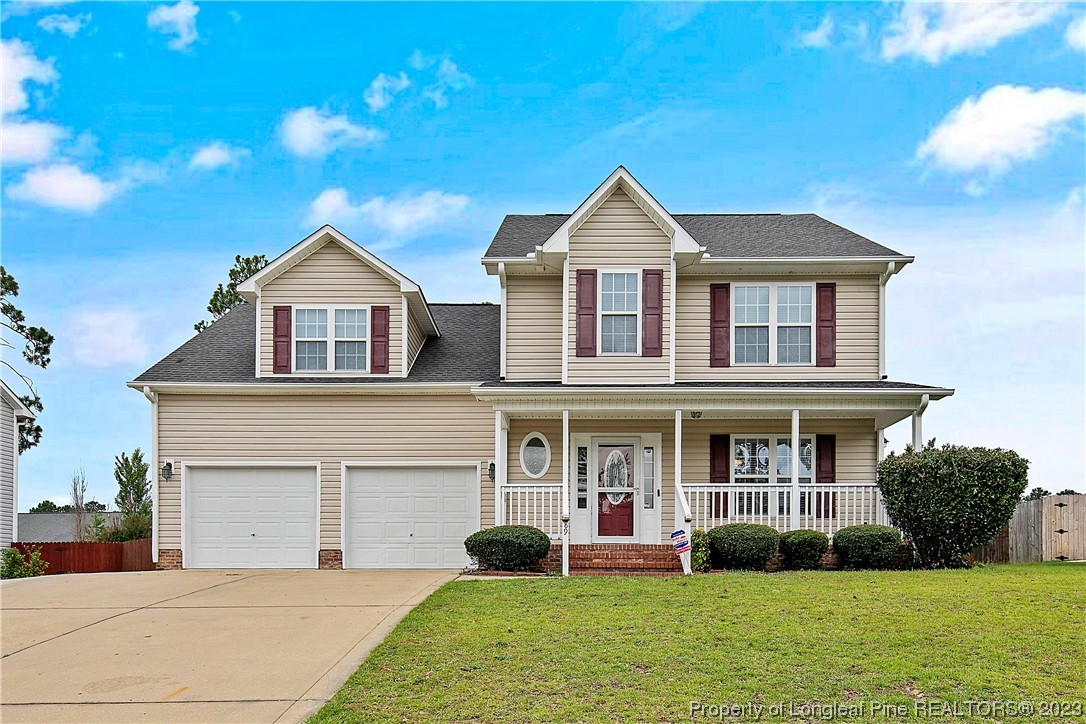 89 Rockingham Street Spring Lake, NC 28390 - Photo 1 of 41 a front view of a house with a yard