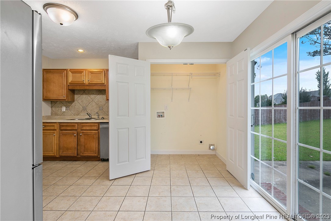 89 Rockingham Street Spring Lake, NC 28390 - Photo 12 of 41 a bathroom with a sink a toilet and shower