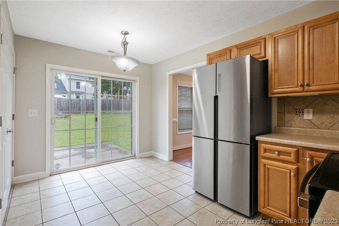 89 Rockingham Street Spring Lake, NC 28390 - Photo 16 of 41 a kitchen with a refrigerator a stove and a refrigerator