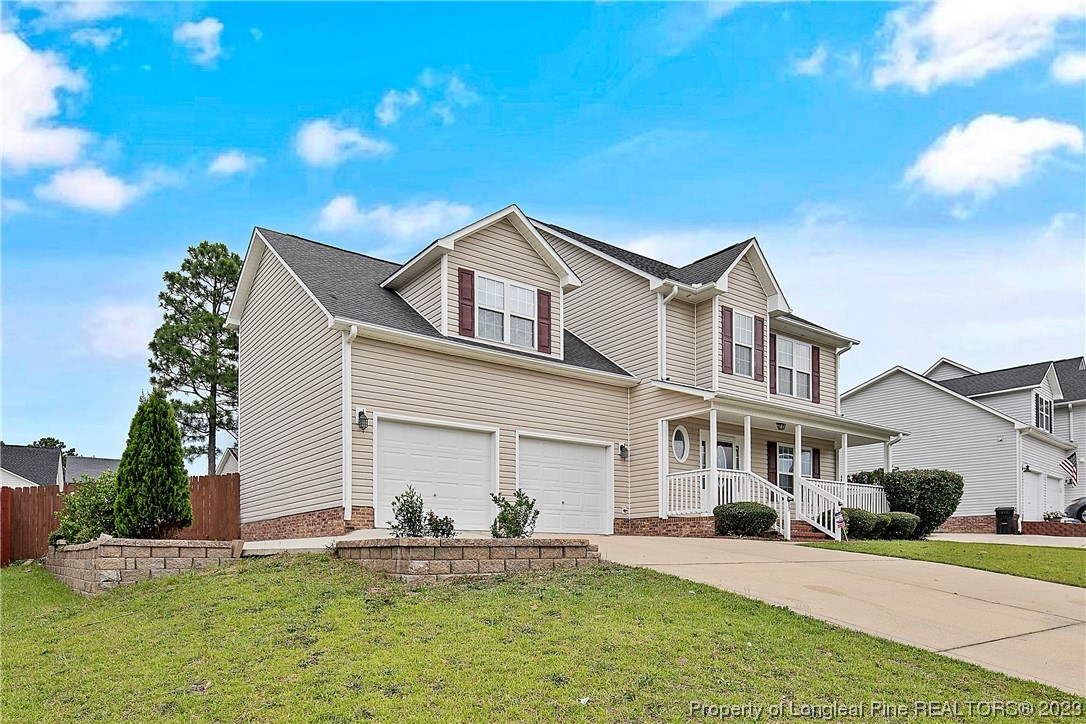 89 Rockingham Street Spring Lake, NC 28390 - Photo 2 of 41 a front view of a house with a yard