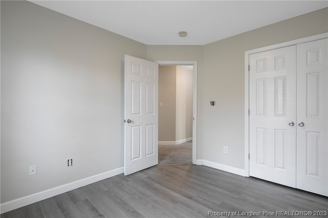 89 Rockingham Street Spring Lake, NC 28390 - Photo 26 of 41 a view of an empty room with wooden floor