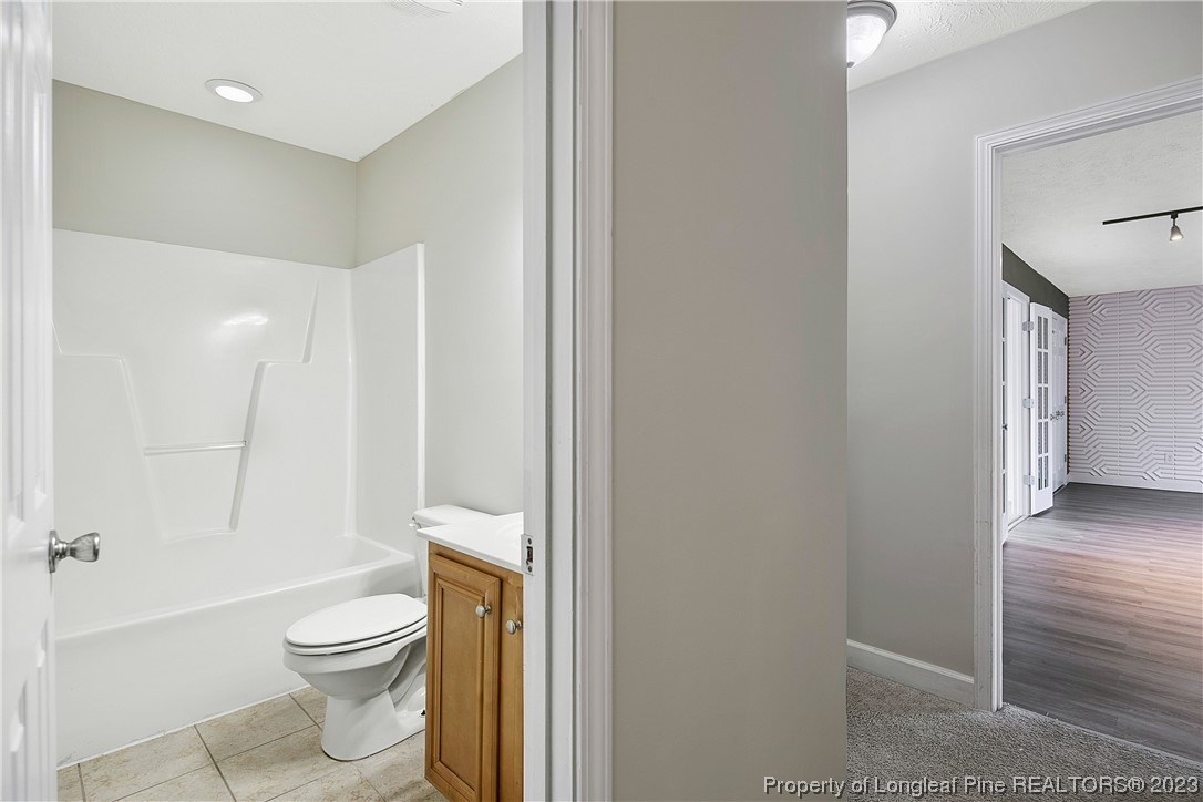 89 Rockingham Street Spring Lake, NC 28390 - Photo 27 of 41 a bathroom with a toilet and a shower