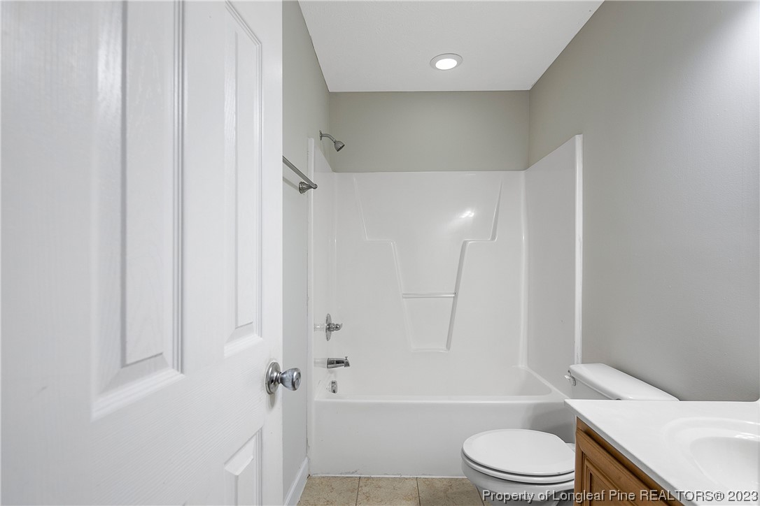 89 Rockingham Street Spring Lake, NC 28390 - Photo 28 of 41 a bathroom with a toilet a sink and shower