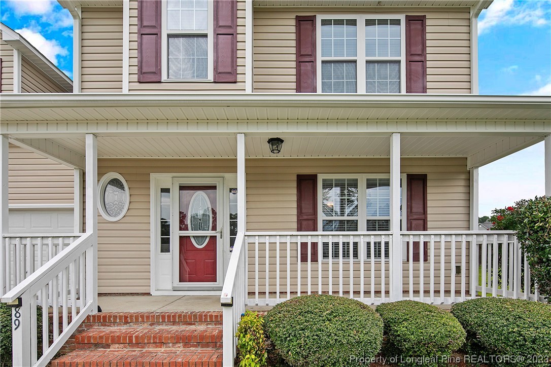 89 Rockingham Street Spring Lake, NC 28390 - Photo 3 of 41 a front view of a house with a porch