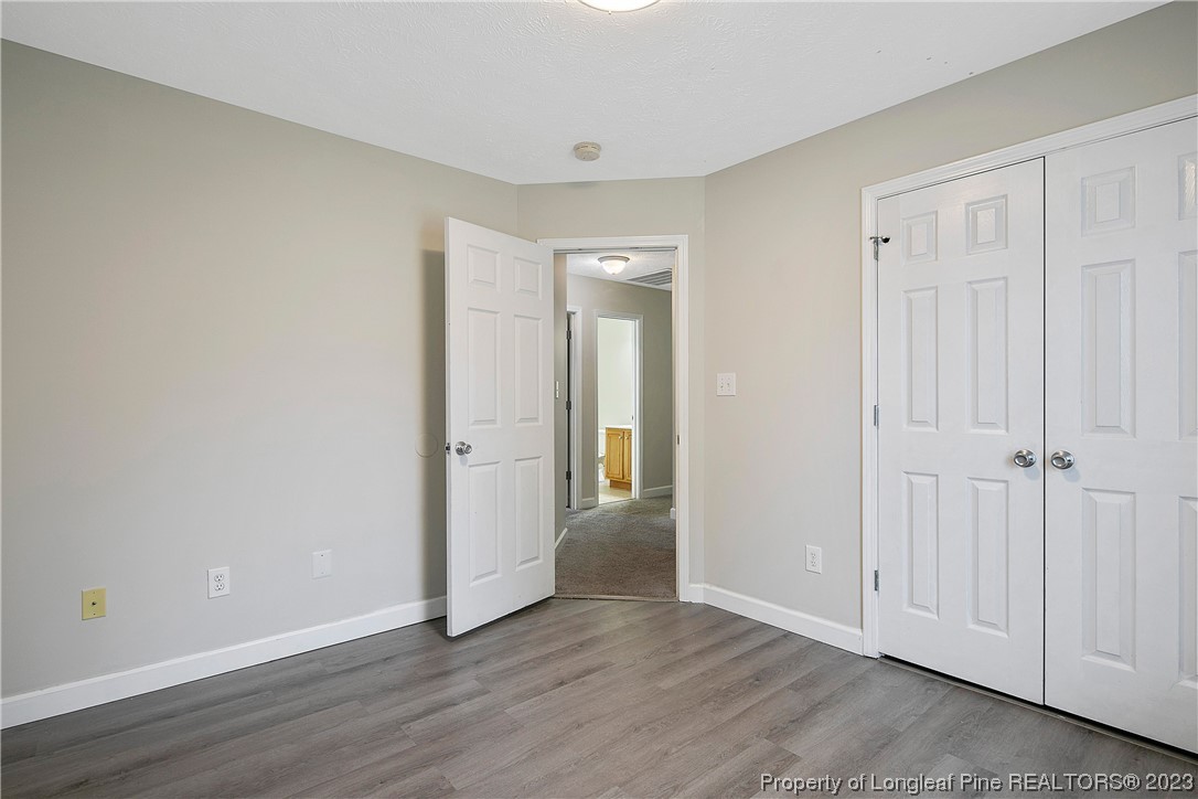 89 Rockingham Street Spring Lake, NC 28390 - Photo 32 of 41 a view of an empty room and wooden floor