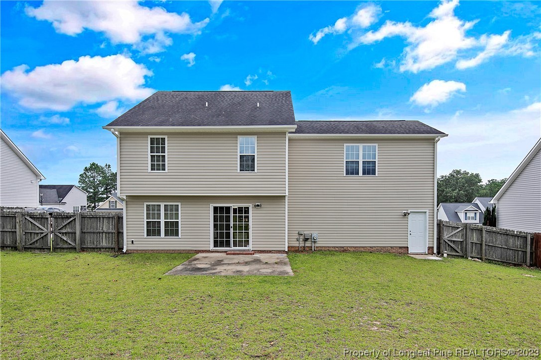 89 Rockingham Street Spring Lake, NC 28390 - Photo 38 of 41 a front view of a house with a garden