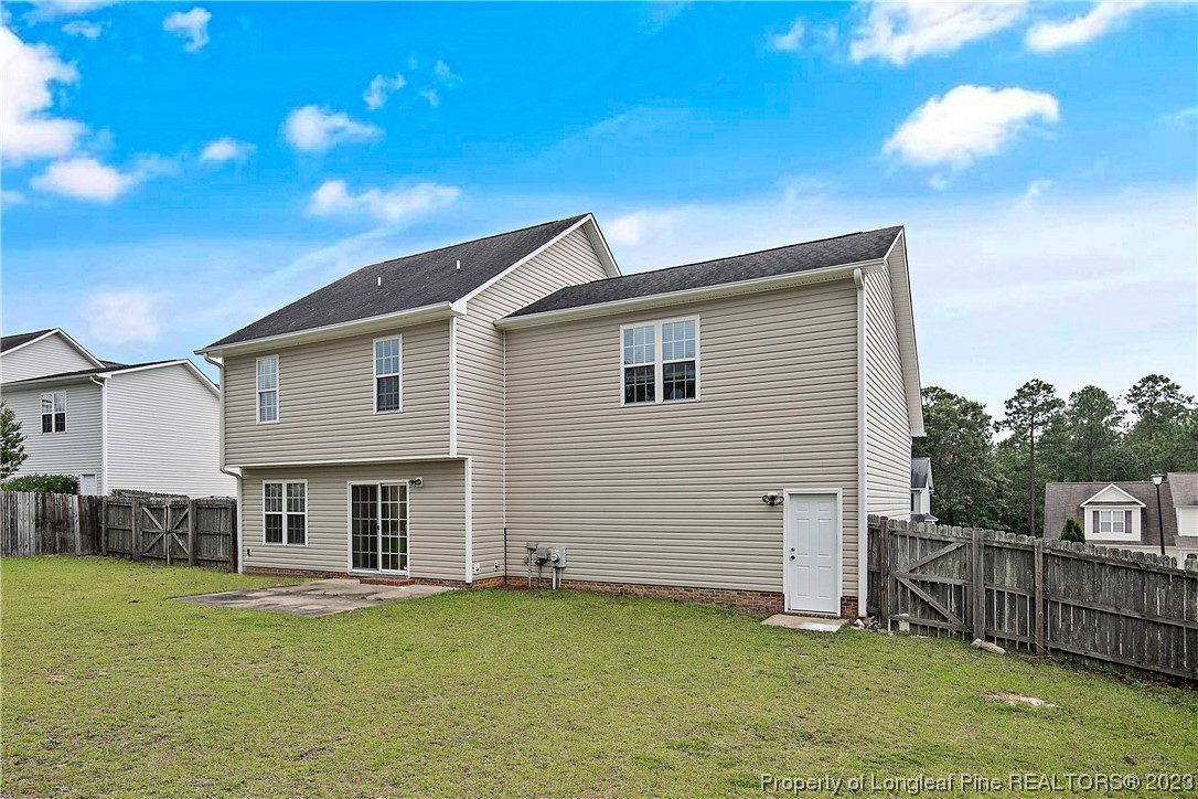 89 Rockingham Street Spring Lake, NC 28390 - Photo 39 of 41 a view of a house with a yard