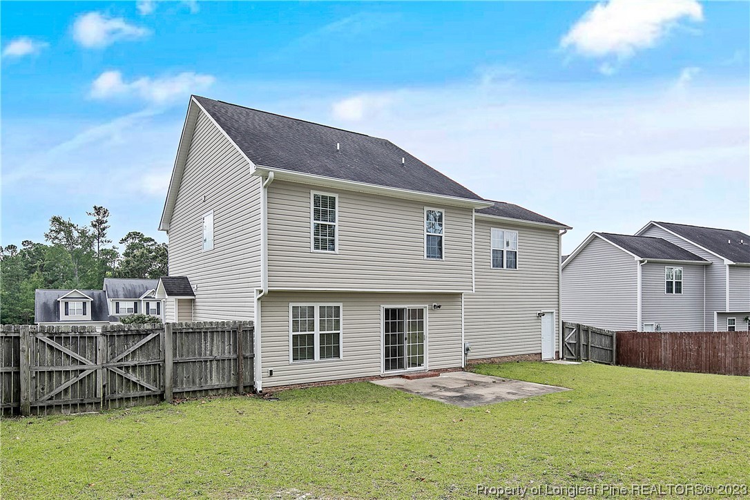 89 Rockingham Street Spring Lake, NC 28390 - Photo 40 of 41 a front view of a house with a yard