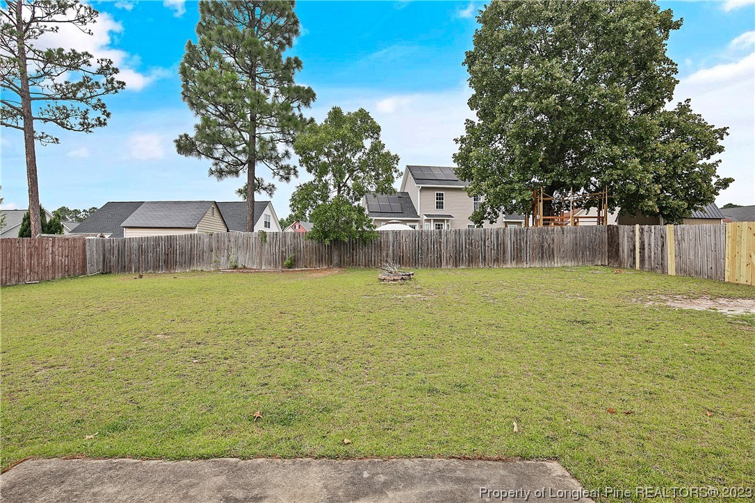 89 Rockingham Street Spring Lake, NC 28390 - Photo 41 of 41 a swimming pool that has lawn chairs next to a yard
