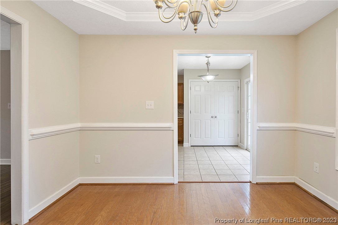 89 Rockingham Street Spring Lake, NC 28390 - Photo 10 of 41 a view of an empty room with wooden floor