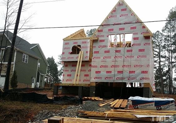 5308 Olive Road Raleigh, NC 27606 - Photo 2 of 6 a front view of a house with large windows