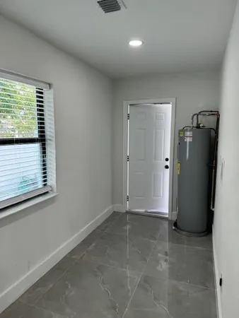 a view of an empty room and window