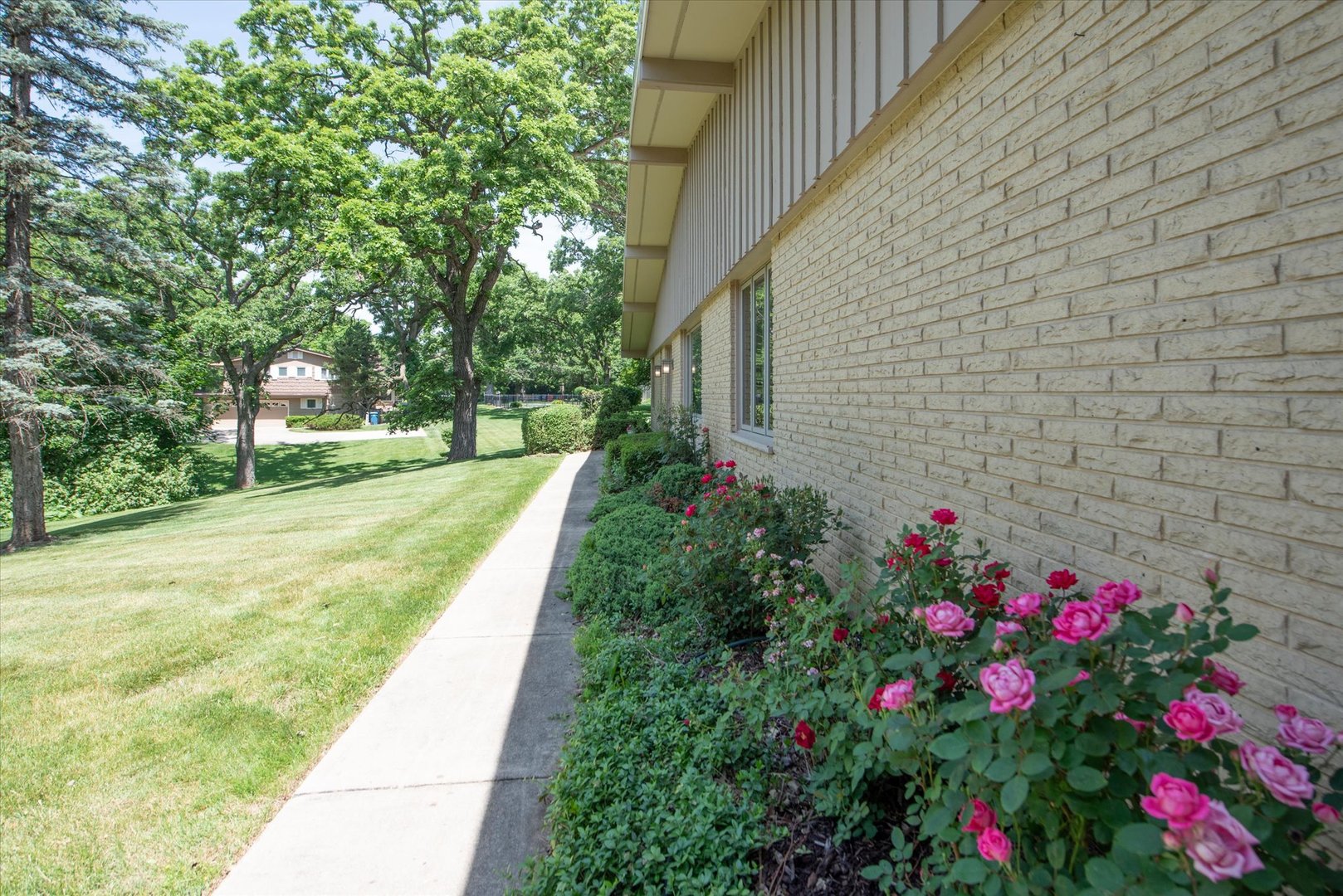 1196 Nottingham Lane Elgin, IL 60120 - Photo 6 of 45 a view of flower garden with a building in the background