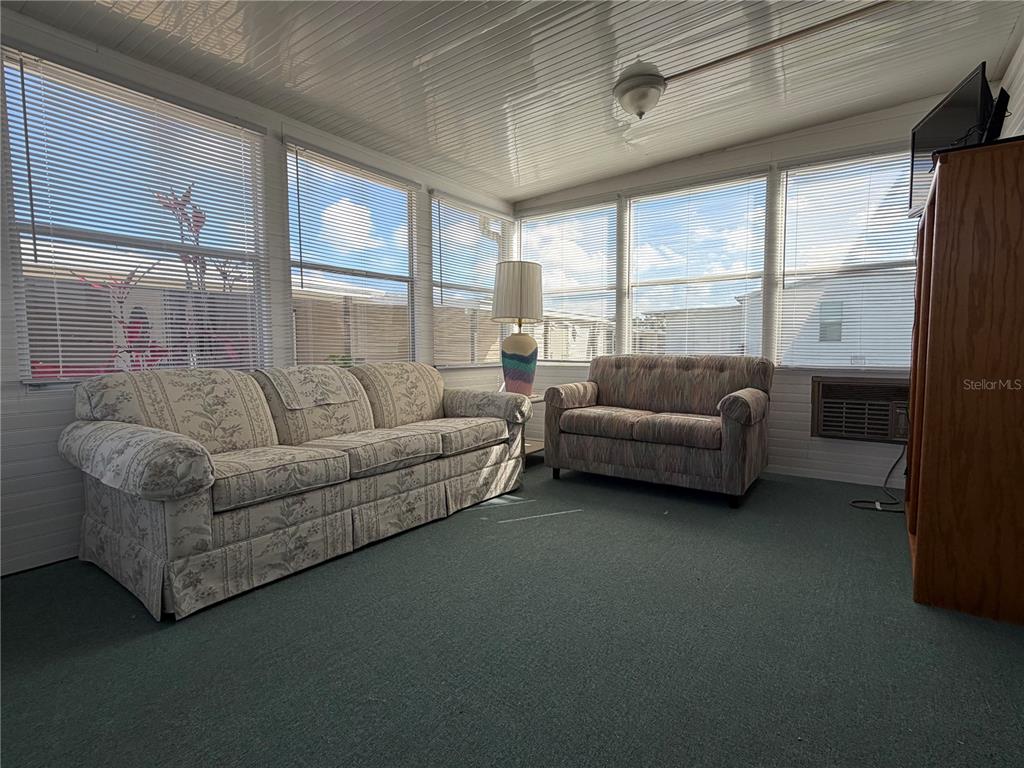 208 Eagle Punta Gorda, FL 33950 - Photo 11 of 16 a living room with furniture and a large window
