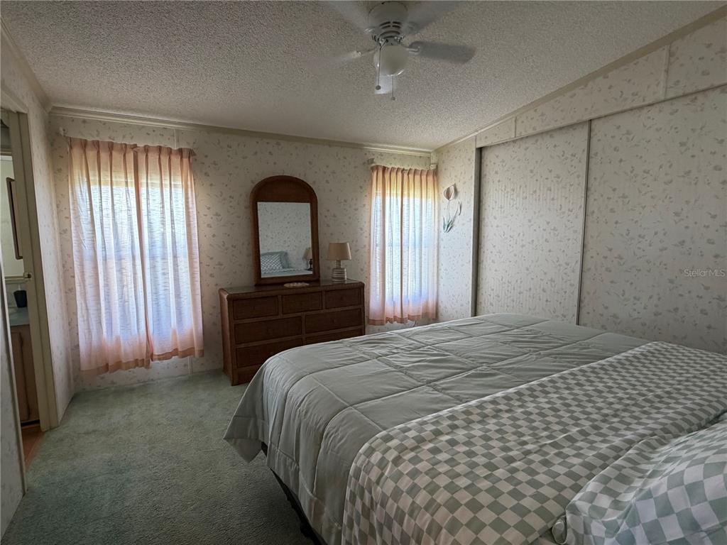 208 Eagle Punta Gorda, FL 33950 - Photo 12 of 16 a bedroom with a bed and a dresser