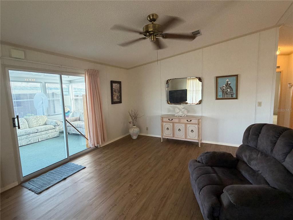 208 Eagle Punta Gorda, FL 33950 - Photo 9 of 16 a living room with furniture and a flat screen tv