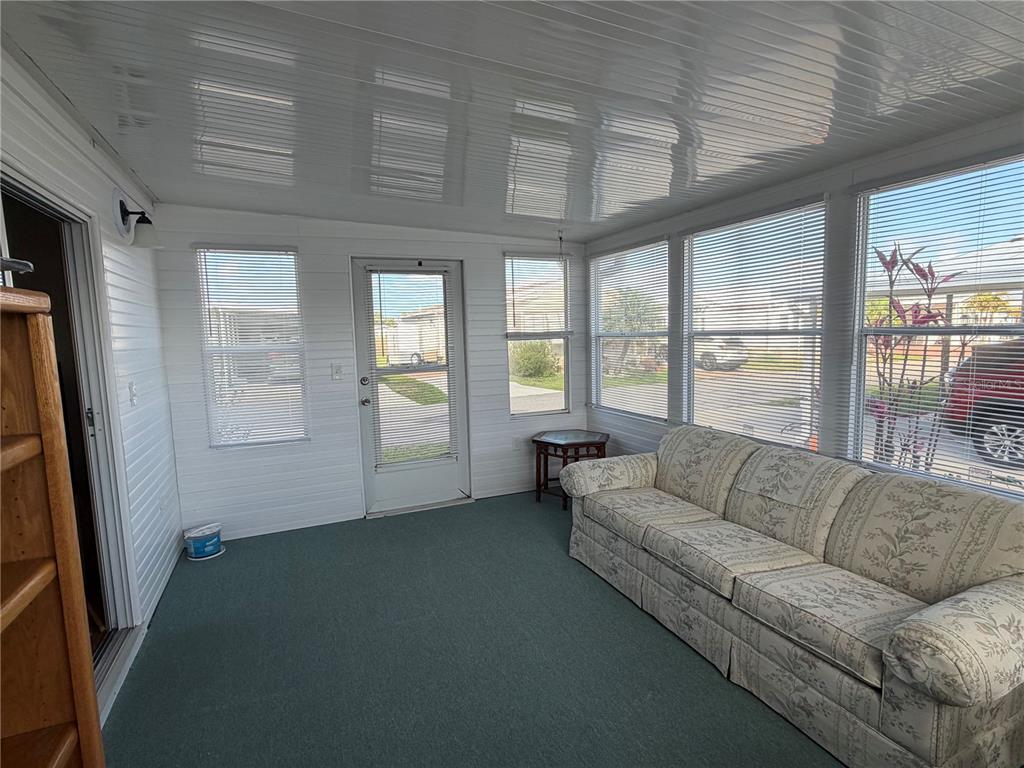 208 Eagle Punta Gorda, FL 33950 - Photo 10 of 16 a living room with furniture and a large window