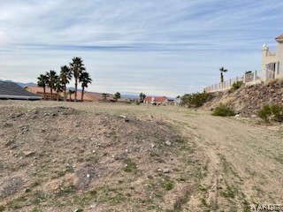 2413 Nez Perce Road Fort Mohave, AZ 86426 - Photo 1 of 2 a view of a dry yard with wooden fence