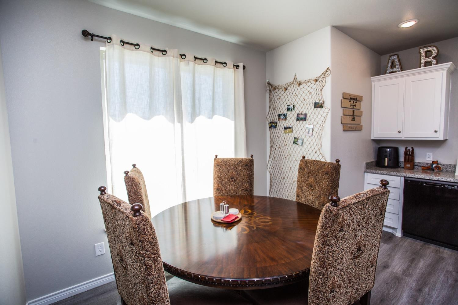 7004 10th Street Lubbock, TX 79416 - Photo 13 of 32 a living room with furniture and a refrigerator