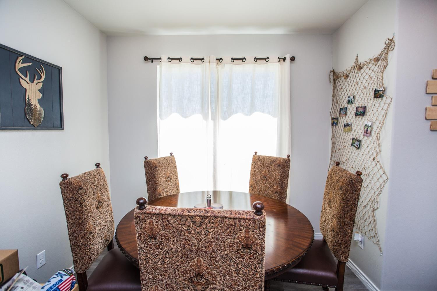 7004 10th Street Lubbock, TX 79416 - Photo 14 of 32 a living room with furniture and a window