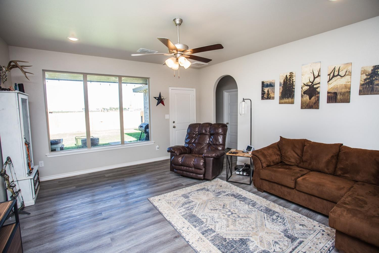 7004 10th Street Lubbock, TX 79416 - Photo 7 of 32 a living room with furniture and a large window