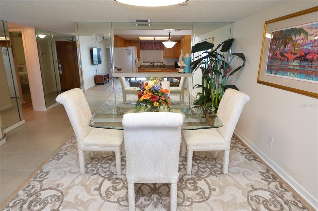 900 Gulf Boulevard, Unit 907 Indian Rocks Beach, FL 33785 - Photo 12 of 88 a dining room with furniture and window