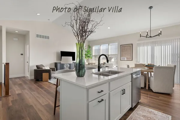 a kitchen with a sink and a refrigerator