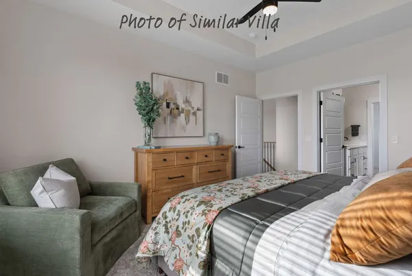 a bedroom with a bed and a couch