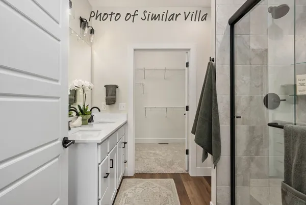 a bathroom with a sink a mirror and shower