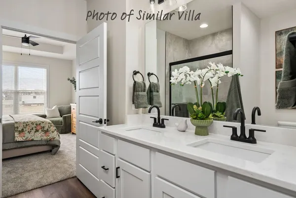 a bathroom with a double vanity sink and a mirror