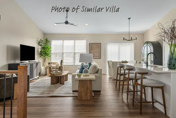 a living room with fireplace furniture and a flat screen tv