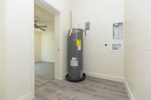 a view of an entryway with wooden floor