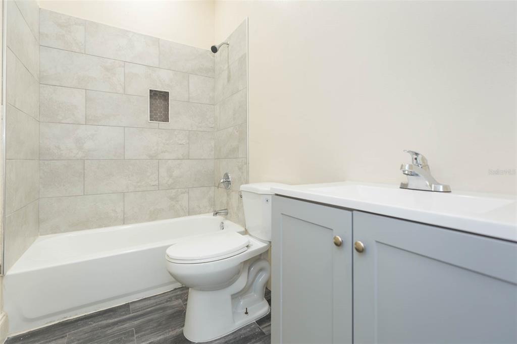 3008 North 17th Street Tampa, FL 33605 - Photo 21 of 28 a bathroom with a sink toilet and shower