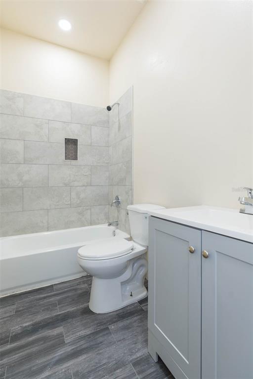 3008 North 17th Street Tampa, FL 33605 - Photo 22 of 28 a bathroom with a toilet a sink and bathtub