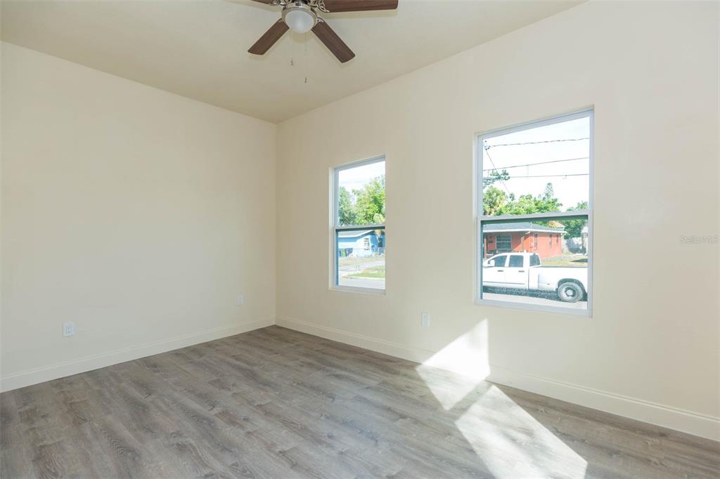 3008 North 17th Street Tampa, FL 33605 - Photo 23 of 28 a view of empty room with wooden floor and fan